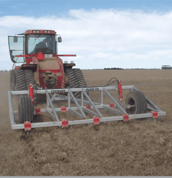 12 Yeomans plow working soil, depth control wheels