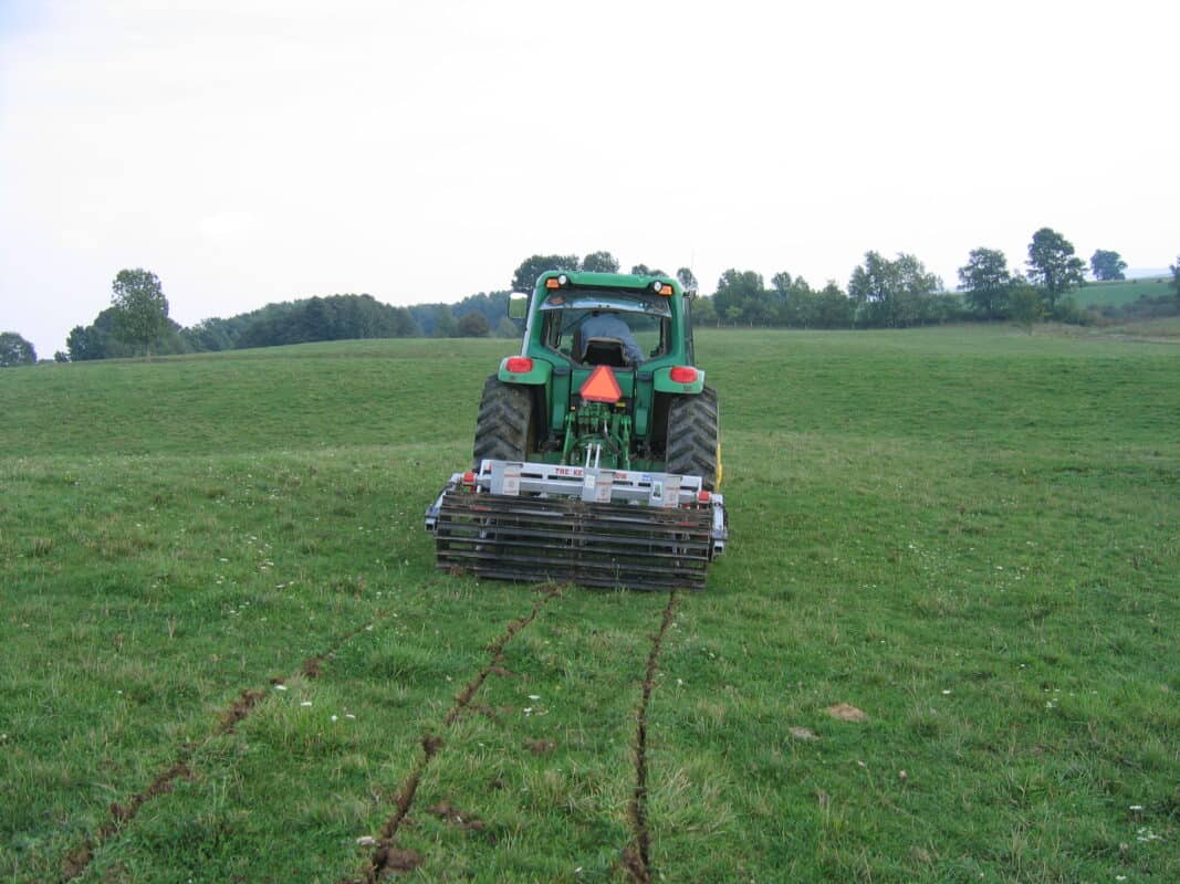 Yeomans plow working fitted fixed shanks and crumble roller also tickle pot seeders, coulters on john deere tractor