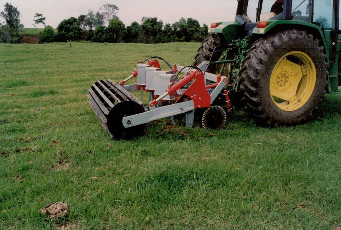 Yeomans plow working fitted fixed shanks and crumble roller also tickle pot seeders, coulters on john deere tractor