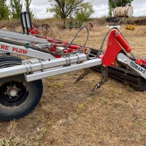 Yeomans keyline plow fitted with hydraulic crumble roller